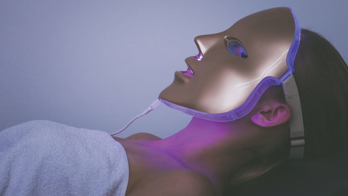 Woman in LED mask