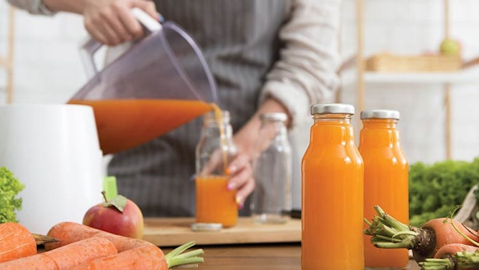 Woman pouring juice