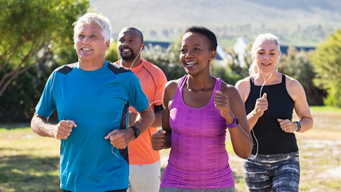 Healthy group of people jogging outdoors