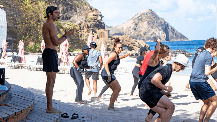 Akin Akman leading beach boot camp at BodyHoliday fitness retreat.