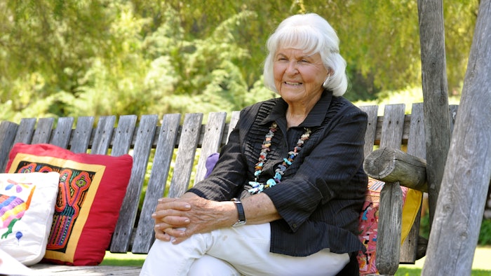 Deborah Szekely, Cofounder, Rancho La Puerta sitting on a bench in Tecate