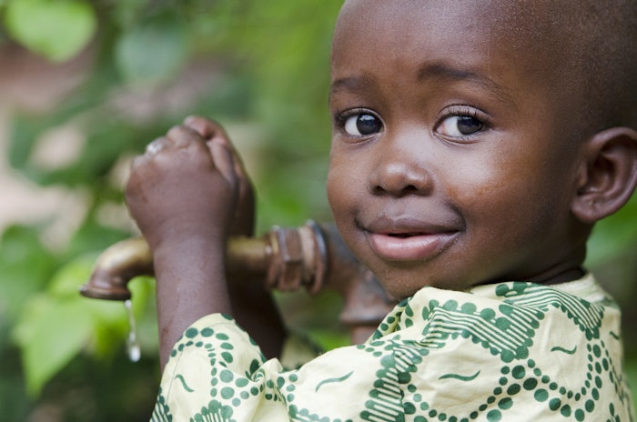 Little girl enjoying fresh drinking water