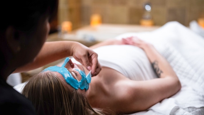 woman receiving a facial treatment at stillwater spa