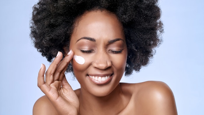 Woman applying skin care