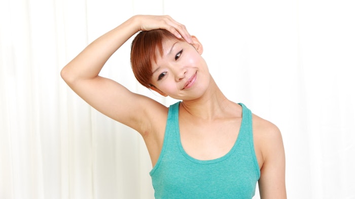 woman doing a neck stretch