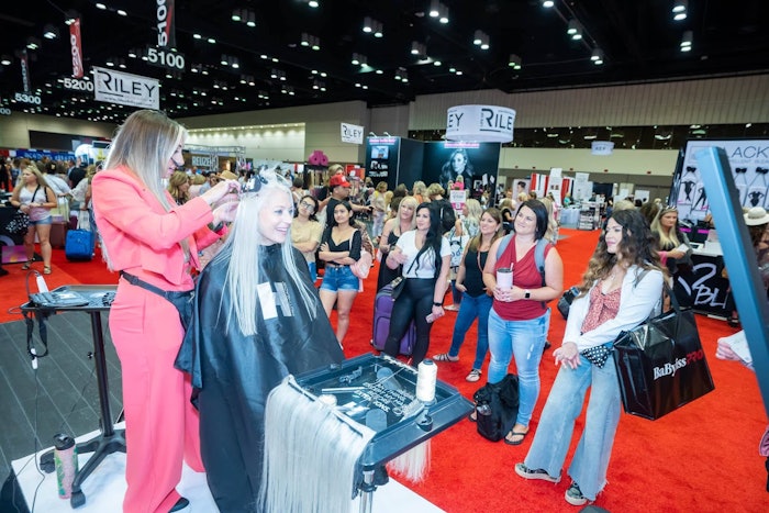 Stylist doing a demo for attendees at Premiere Orlando 2022