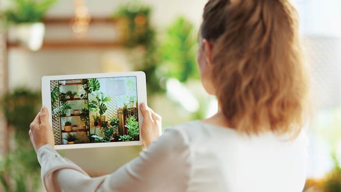 woman shooting video of decorated space