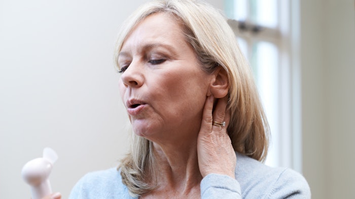 woman with hot flashes menopause symptoms