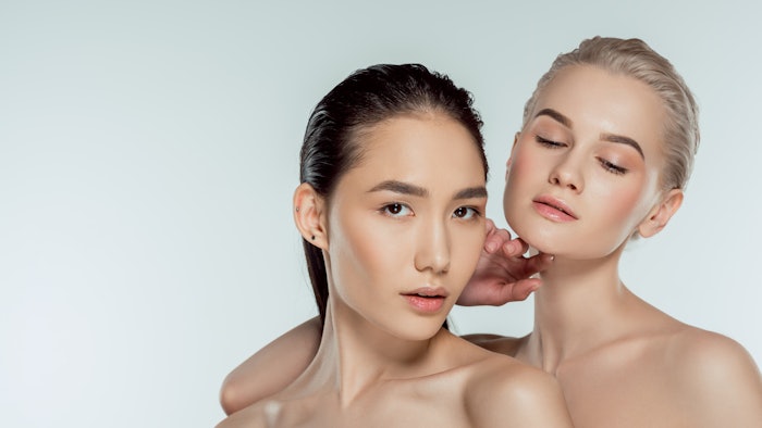 two multiethnic women posing